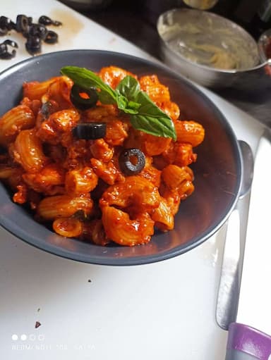 Tasty Chicken Pasta in Red Sauce cooked by COOX chefs cooks during occasions parties events at home