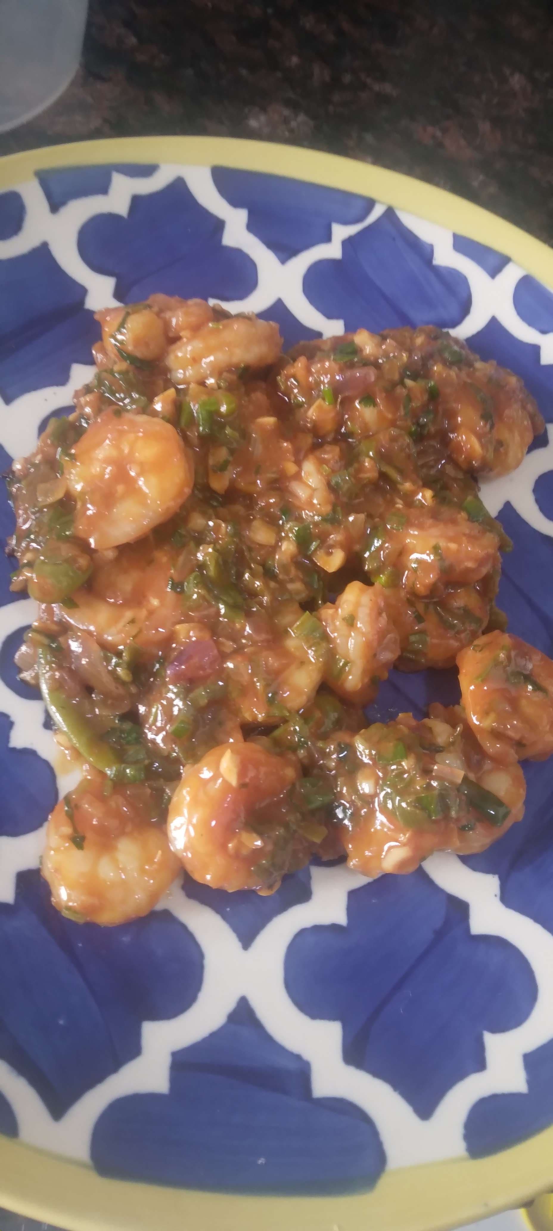 Tasty Red Chilli Prawns cooked by COOX chefs cooks during occasions parties events at home
