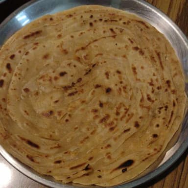 Tasty Lachha Paranthas cooked by COOX chefs cooks during occasions parties events at home
