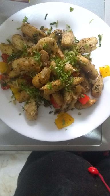 Delicious Crispy Chilly Baby Corn prepared by COOX