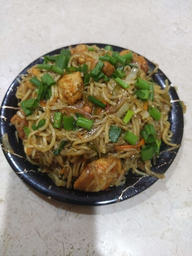 Tasty Chicken Chilli Garlic Noodles cooked by COOX chefs cooks during occasions parties events at home