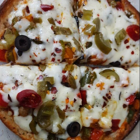 Delicious Classic Veg Pizza prepared by COOX