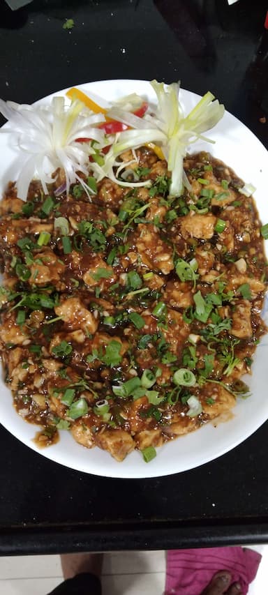 Tasty Chicken Manchurian (Dry) cooked by COOX chefs cooks during occasions parties events at home