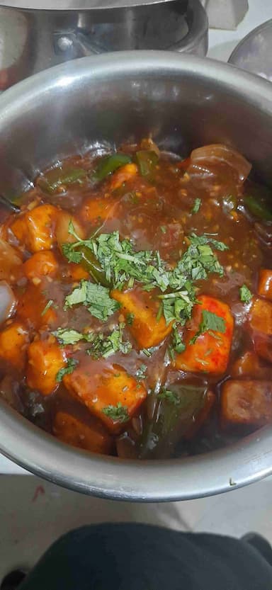Tasty Chilli Paneer (Gravy) cooked by COOX chefs cooks during occasions parties events at home