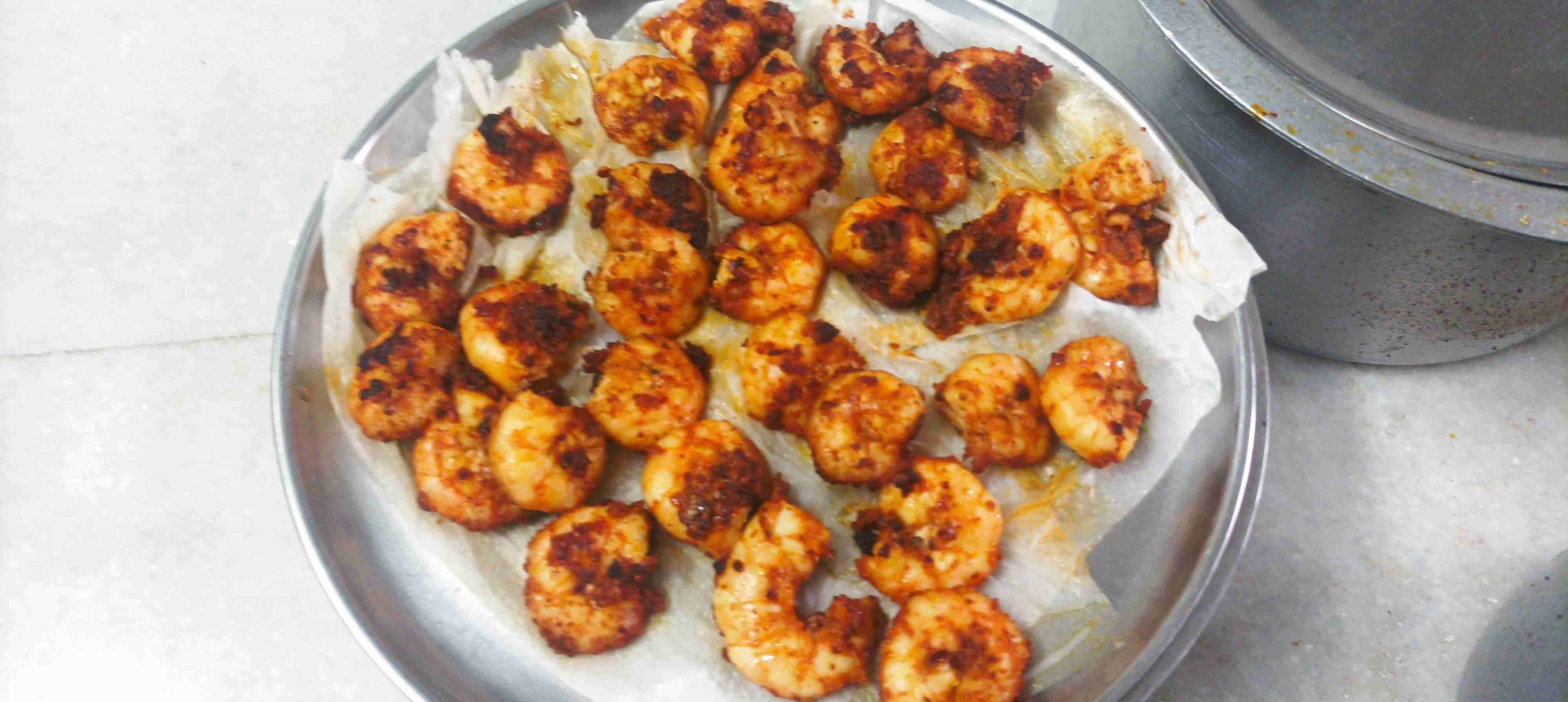 Tasty Red Chilli Prawns cooked by COOX chefs cooks during occasions parties events at home