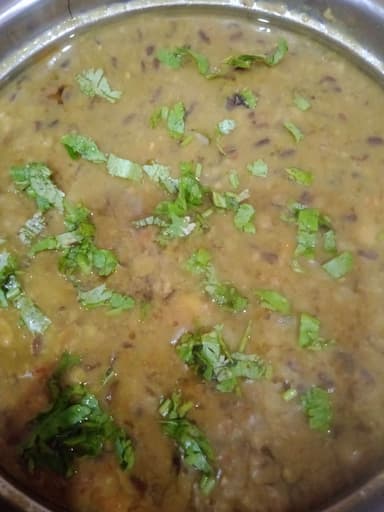 Tasty Urad Dal cooked by COOX chefs cooks during occasions parties events at home