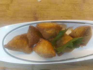 Tasty Mini Samosas cooked by COOX chefs cooks during occasions parties events at home