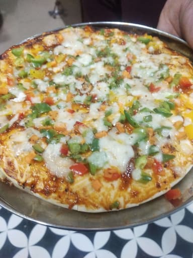 Tasty Veg Pizza cooked by COOX chefs cooks during occasions parties events at home