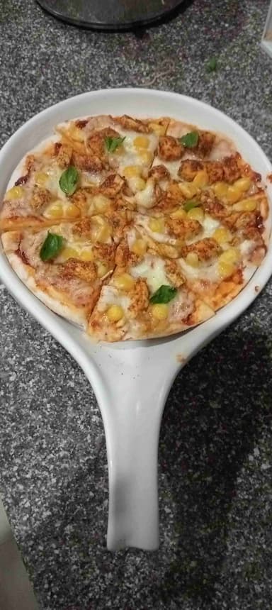 Delicious Chicken Pizza prepared by COOX