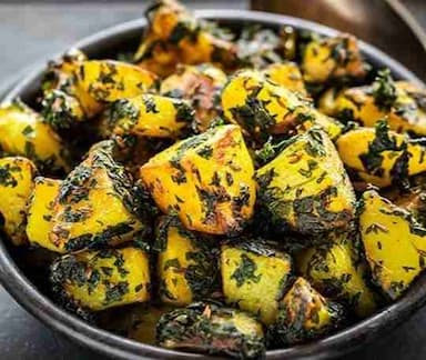 Tasty Aloo Methi cooked by COOX chefs cooks during occasions parties events at home