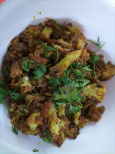 Tasty Adraki Gobhi cooked by COOX chefs cooks during occasions parties events at home