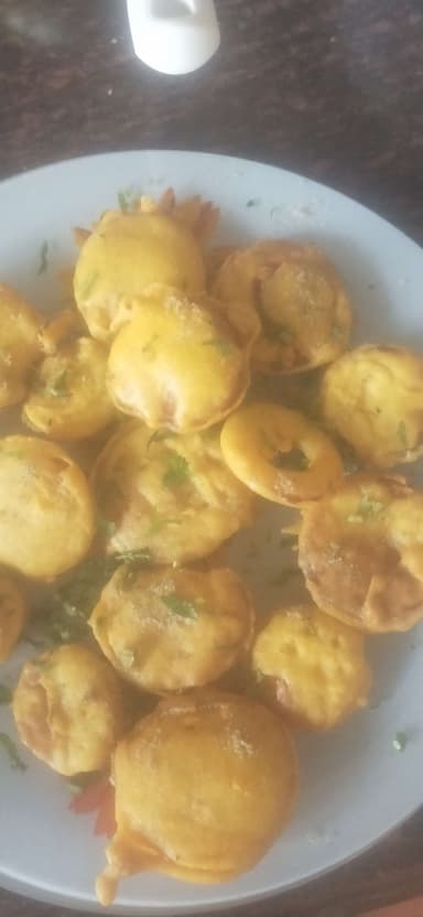 Tasty Onion Pakora cooked by COOX chefs cooks during occasions parties events at home