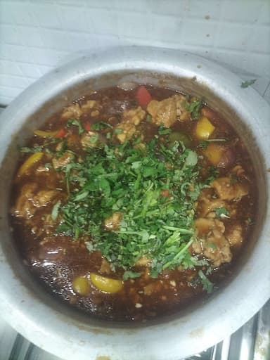 Tasty Chicken in Schezwan Sauce cooked by COOX chefs cooks during occasions parties events at home