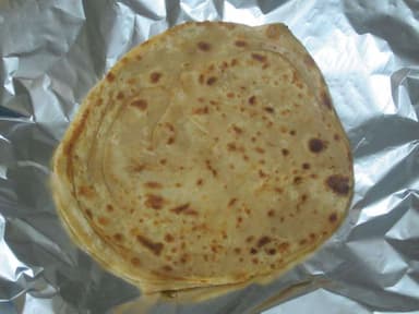 Tasty Lachha Parathas cooked by COOX chefs cooks during occasions parties events at home