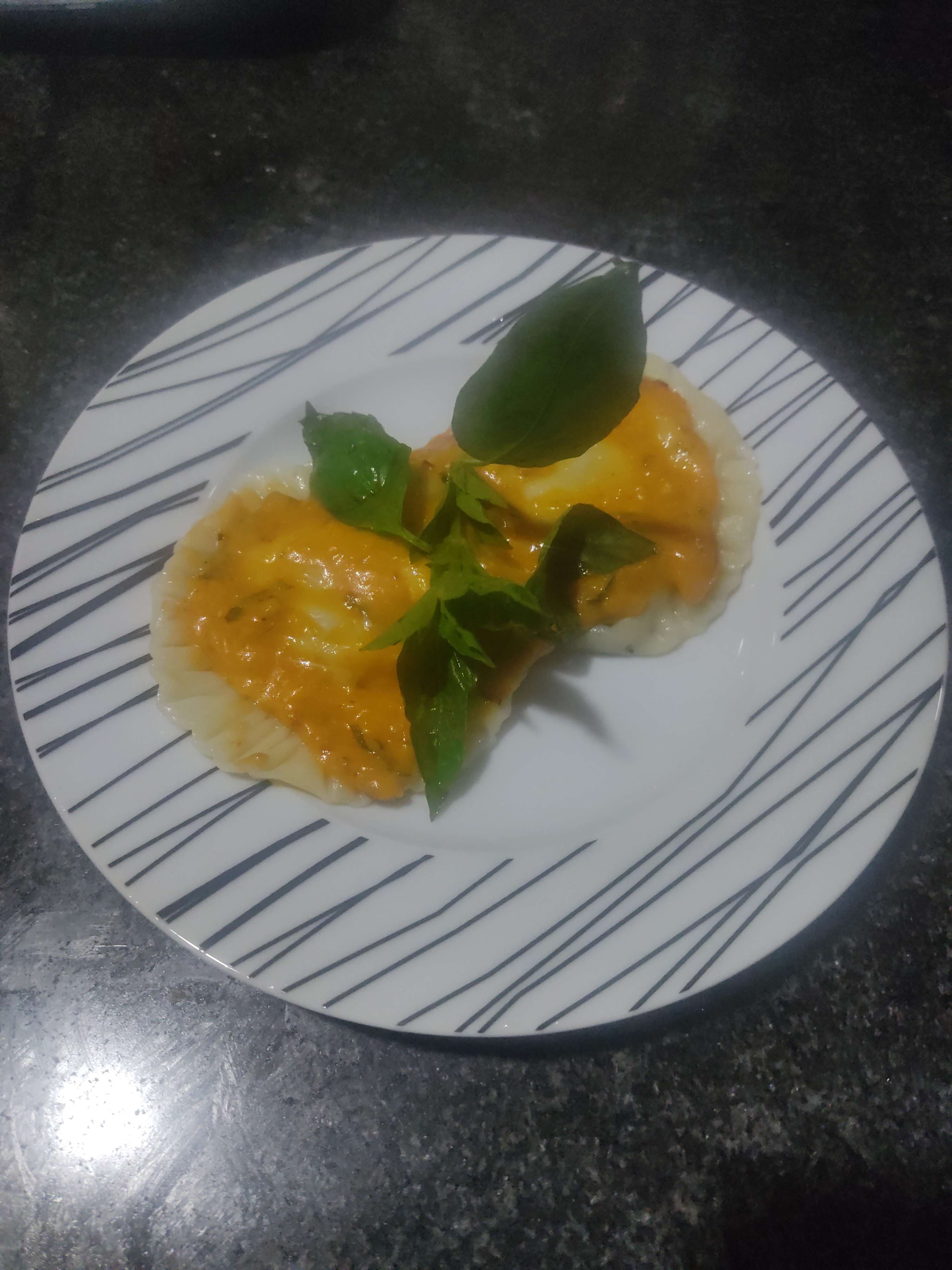 Delicious Ravioli in Pink Sauce prepared by COOX
