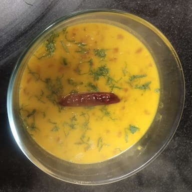 Tasty Dal Tadka cooked by COOX chefs cooks during occasions parties events at home