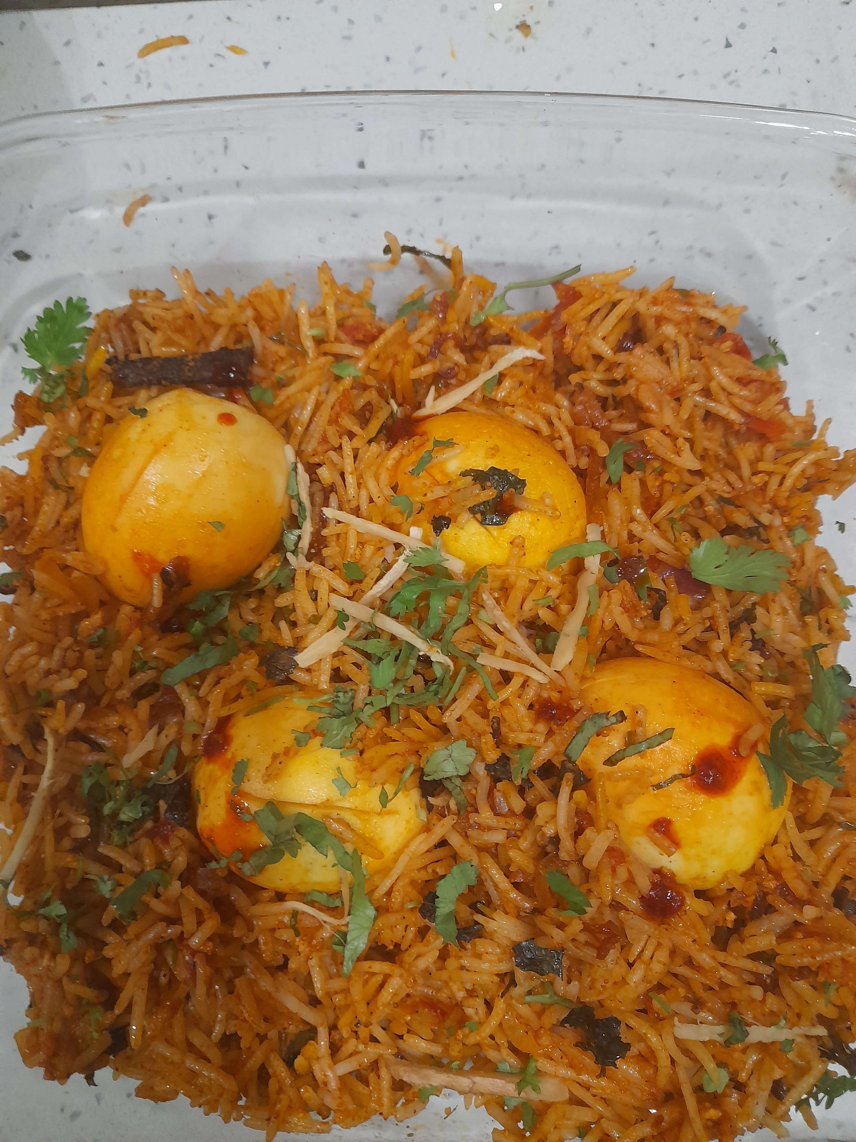 Tasty Egg Biryani cooked by COOX chefs cooks during occasions parties events at home