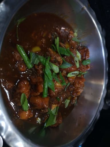 Tasty Chicken in Schezwan Sauce cooked by COOX chefs cooks during occasions parties events at home