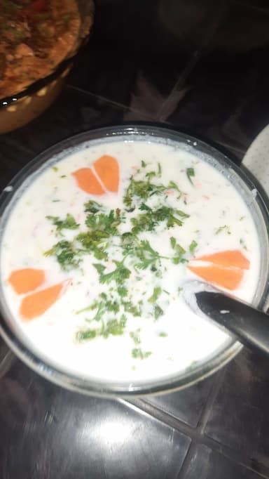 Tasty Plain Raita cooked by COOX chefs cooks during occasions parties events at home