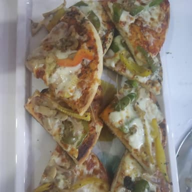 Tasty Classic Veggie Pizza cooked by COOX chefs cooks during occasions parties events at home
