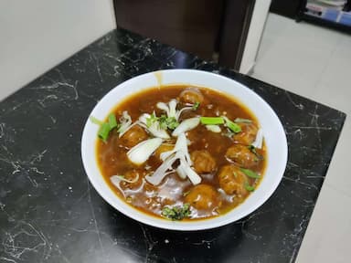 Tasty Veg Manchurian (Gravy) cooked by COOX chefs cooks during occasions parties events at home