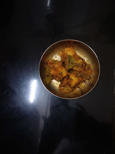 Delicious Aloo Shimla Mirch prepared by COOX