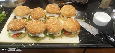 Tasty Chicken Tikka Burgers cooked by COOX chefs cooks during occasions parties events at home