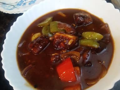 Delicious Chilli Paneer Gravy prepared by COOX