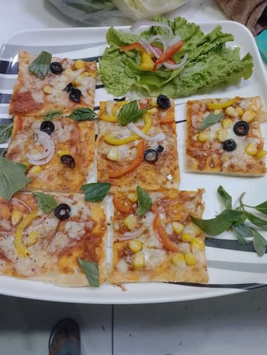 Tasty Margherita Pizza cooked by COOX chefs cooks during occasions parties events at home