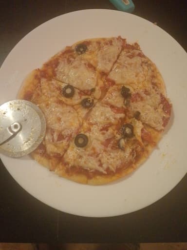 Delicious Pepperoni Pizza prepared by COOX