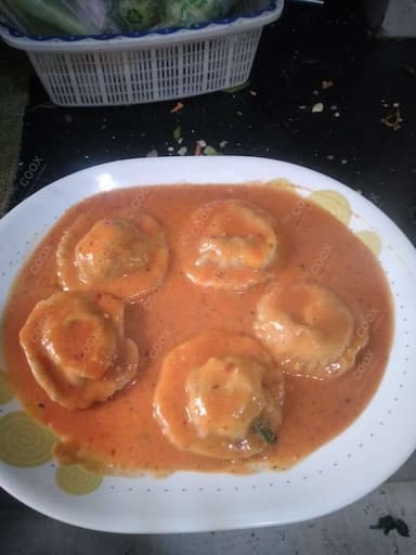 Delicious Ravioli in Pink Sauce prepared by COOX