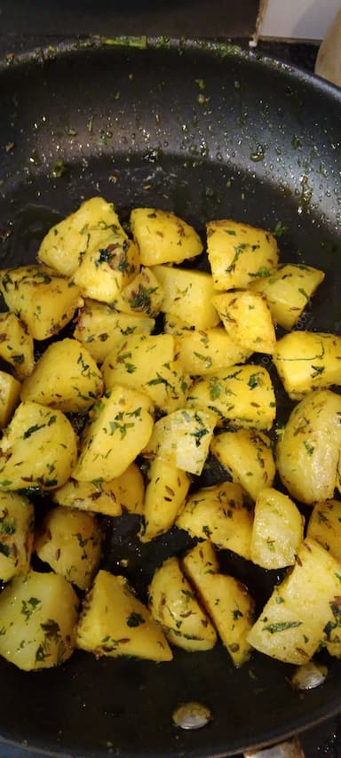 Delicious Jeera Aloo prepared by COOX