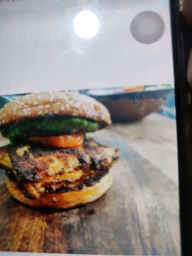Delicious Paneer Tikka Burger prepared by COOX