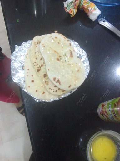 Tasty Naan (Butter / Garlic) cooked by COOX chefs cooks during occasions parties events at home