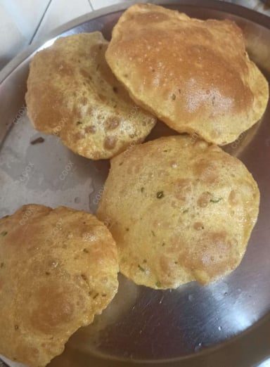 Tasty Pooris & Bedmis cooked by COOX chefs cooks during occasions parties events at home