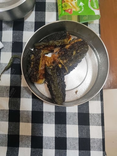 Tasty Karele ki Sabzi cooked by COOX chefs cooks during occasions parties events at home