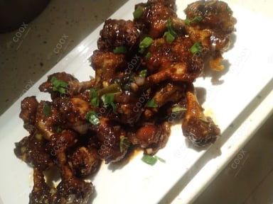 Tasty Chicken Lollipop cooked by COOX chefs cooks during occasions parties events at home