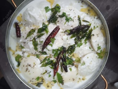 Tasty Dahi Idli cooked by COOX chefs cooks during occasions parties events at home