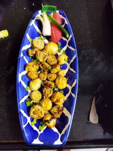 Tasty Mushroom Tikka cooked by COOX chefs cooks during occasions parties events at home
