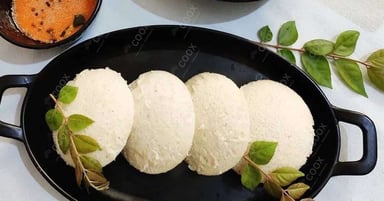 Tasty Plain Idli cooked by COOX chefs cooks during occasions parties events at home