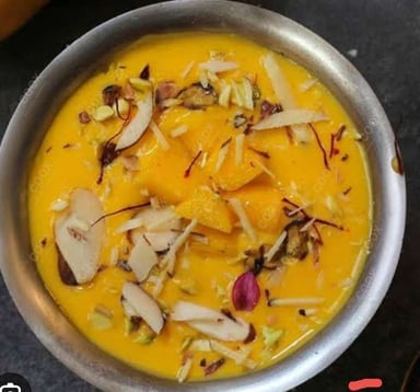 Tasty Mango Phirni cooked by COOX chefs cooks during occasions parties events at home