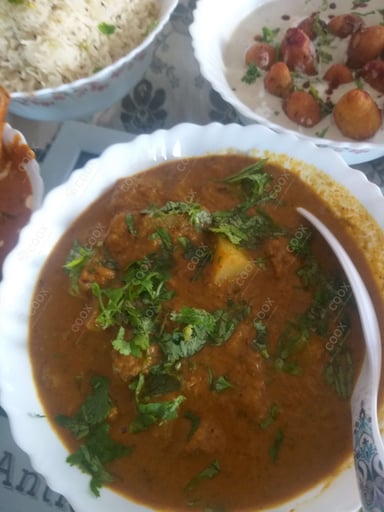Tasty Dum Aloo cooked by COOX chefs cooks during occasions parties events at home