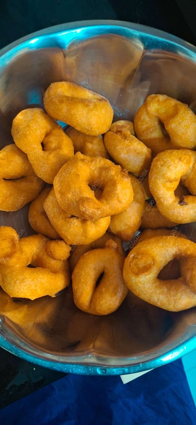 Tasty Medu Vada cooked by COOX chefs cooks during occasions parties events at home