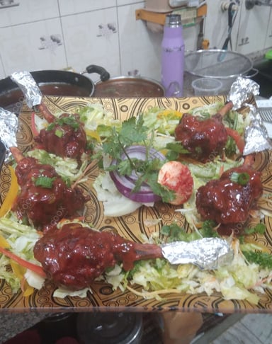 Tasty Chicken Lollipop cooked by COOX chefs cooks during occasions parties events at home
