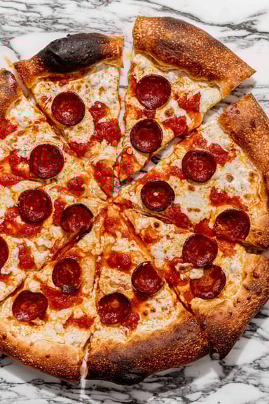 Tasty Pepperoni Pizza cooked by COOX chefs cooks during occasions parties events at home