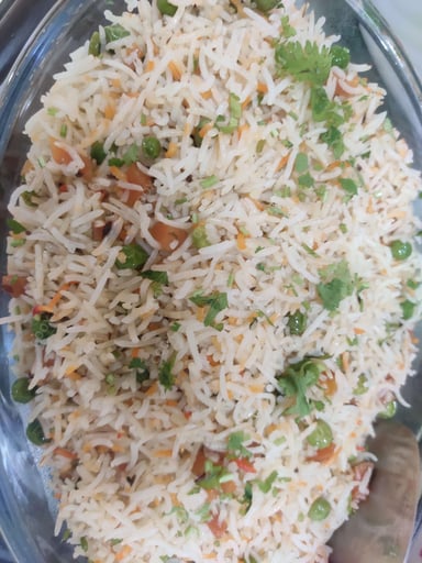 Tasty Schezwan Fried Rice cooked by COOX chefs cooks during occasions parties events at home