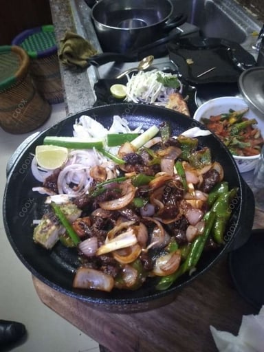 Tasty Crispy Chilli Lamb cooked by COOX chefs cooks during occasions parties events at home