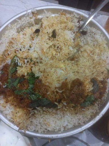 Tasty Egg Biryani cooked by COOX chefs cooks during occasions parties events at home