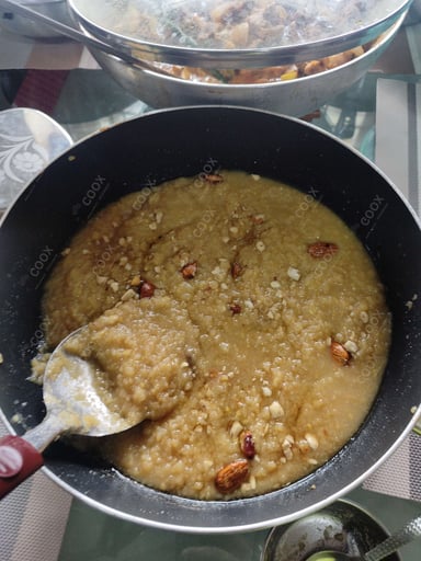 Tasty Moong Dal Halwa cooked by COOX chefs cooks during occasions parties events at home