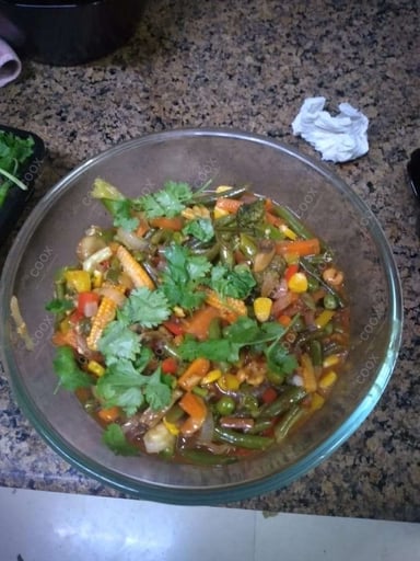 Tasty Mix Veg in Hot Garlic Sauce cooked by COOX chefs cooks during occasions parties events at home